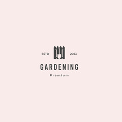 home gardening logo, fence combine with shovel logo design concept retro hipster vintage