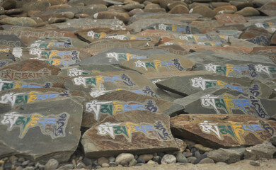 Mani stones with Buddhist mantra "Om Mani Padme Hum" in Zanskar Valley, Ladakh, INDIA