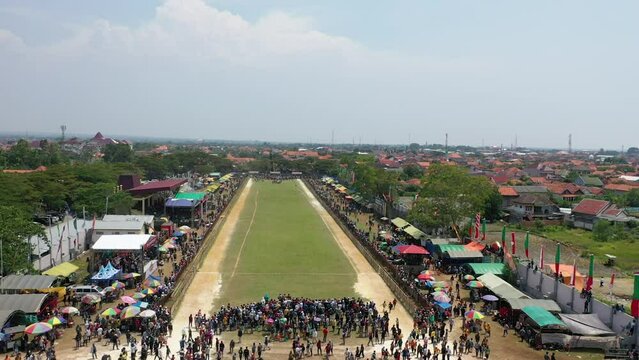 aerial drone of Karapan Sapi field on Madura Island at Pamekasan Stadium, Madura, Indonesia