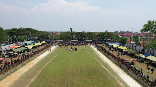 Beautiful drone shot for the Karapan Sapi final held annually on Madura Island at Pamekasan Stadium, Madura, Indonesia