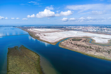 Aerial view of the rafts of phosphogypsum at shore of the Tinto river. Waste of the production of fertilizer from phosphate rock deposited in the capital of Huelva, Andalusia. Contamination concept