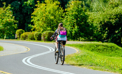Fototapeta premium Cyclist ride on the bike path in the city Park 