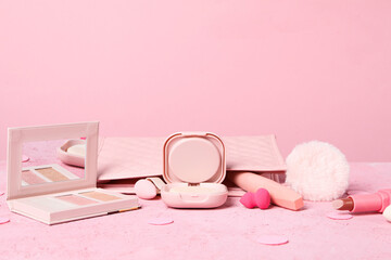 Pink tools and accessories for women's makeup.
