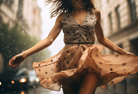 A photo of a woman in short skirt walking through the rain dancing and wind