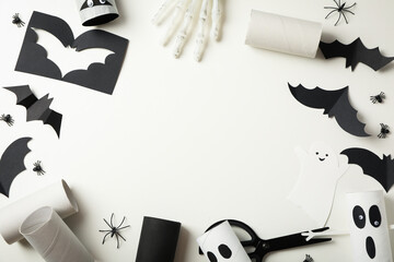 Paper ghosts and bats on white background, space for text