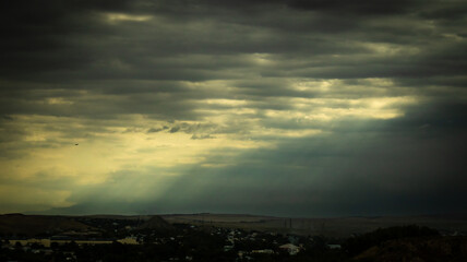 Obraz premium Overcast sky with dark clouds. Dark sky before a thunder-storm. The gray cloud background before rain.