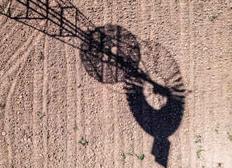 Old time windmill in field with shadow. .