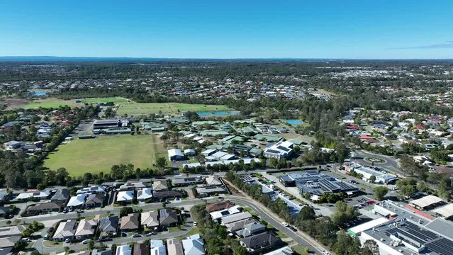 Drone aerial shot orbiting the Narangba Valley State High School. Brisbane Queensland Suburb. Clear mid day shot. QLD EDUCATION AUSTRALIA