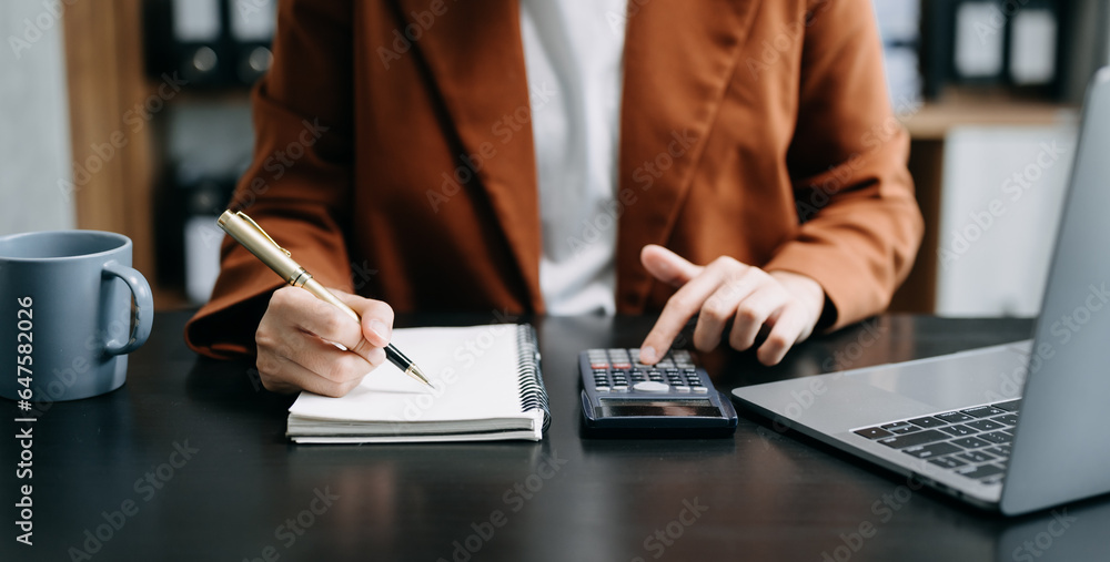 Poster bussinessman analyzing sales data and economic growth and pointing at business report document with 