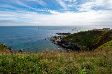 Lizard, Cornwall, UK - August, 2023: View of Lizard Point in Cornwall - the most southern point of England's mainland. Copy space in sky.