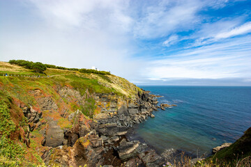 Lizard, Cornwall, UK - August, 2023: View of Lizard Point in Cornwall - the most southern point of England's mainland. Copy space in sky.