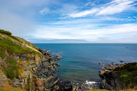 Lizard, Cornwall, UK - August, 2023: View of Lizard Point in Cornwall - the most southern point of England's mainland. Copy space in sky.