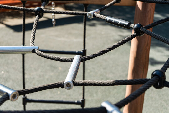 Close-up of a rope climbing frame in a playground in summer