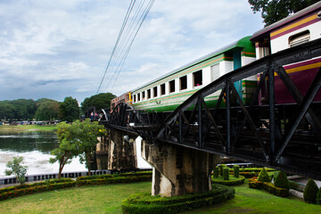 Steel railway bridge over river kwai of landmarks memorials historical sites and monuments World War II Sites for thai people foreign travelers travel visit and train running in Kanchanaburi, Thailand