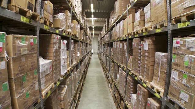 Interior storage warehouse, jib crane movement modern shelves with cardboards