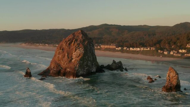Rising aerial shot of Haystack rock and Cannon beach