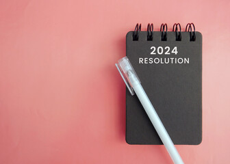 2024 Happy New Year with Resolution notebook and white pen. countdown, Goals, Plan, Action and...