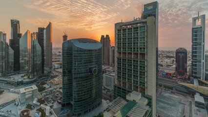Fototapeta na wymiar Sunset over Dubai international financial center skyscrapers aerial timelapse.