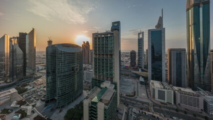 Obraz premium Dubai international financial center skyscrapers with cloudy blue sky aerial all day timelapse.