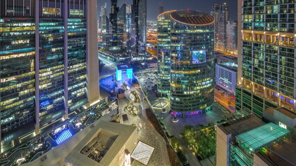 Dubai international financial center skyscrapers aerial day to night timelapse. - obrazy, fototapety, plakaty