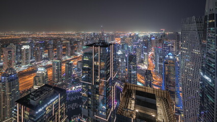 Fototapeta na wymiar Panorama showing JBR district and Dubai Marina with JLT. Traffic between skyscrapers aerial night timelapse.