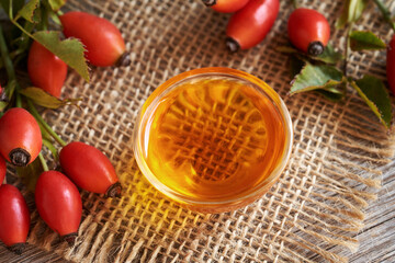 Rose hip seed oil with fresh ripe rosehips