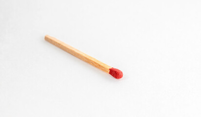 Close up of match isolated on white. Single red match stick.