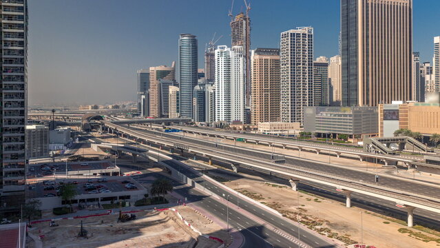 Dubai Marina skyscrapers and Sheikh Zayed road with metro railway aerial timelapse, United Arab Emirates