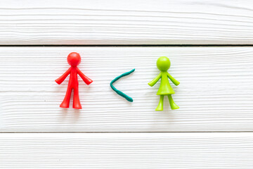 Equal rights of men and women, feminism concept. Male and female figurines, top view