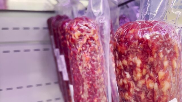sausage shop. smoked sausage on the shelf in the store. butcher shop counter. showcase salami lifestyle