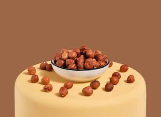 Useful tasty hazelnuts in the plate and on the podium. Natural nutrition.