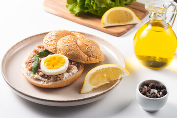 Delicious tuna open sandwiches. Buns with canned tuna, lemon, cream cheese and boiled egg.
