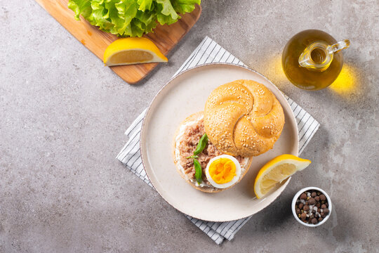 Delicious tuna open sandwiches. Buns with canned tuna, lemon, cream cheese and boiled egg.