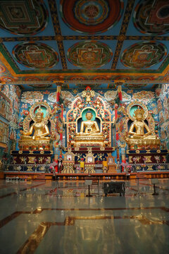 A Portrait picture of the Colorful Interiors of the Buddhist Golden temple dedicated to Avatars of Lord Buddha at the Tibet colony in Bylakuppe in India.