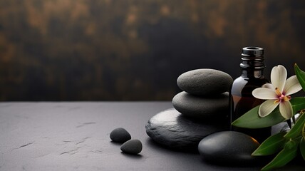 beauty treatment items for spa procedures on dark table. massage stones, essential oils. copy space