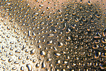 Drops of water on a colored background. Abstract texture