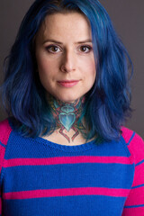 Portrait of the woman with blue hair and a throat tattoo