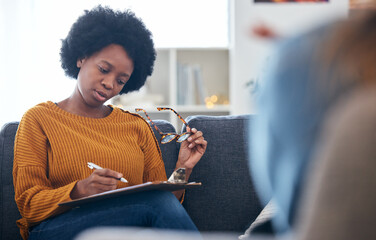 Therapist on sofa, writing notes with patient, advice and help in psychology, listening and mental health care. Conversation, support and black woman on couch with client, psychologist in counseling. - obrazy, fototapety, plakaty