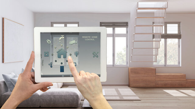 Smart remote home control system on a digital tablet. Device with app icons. Modern minimal living room in the background, architecture interior design