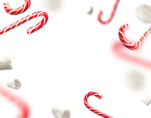 Cut out flying traditional Christmas candy cane, lollipop, white marshmallows isolated on white...