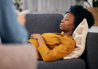 Therapy, sofa and black woman relax in consultation for mental health, help and listening to...