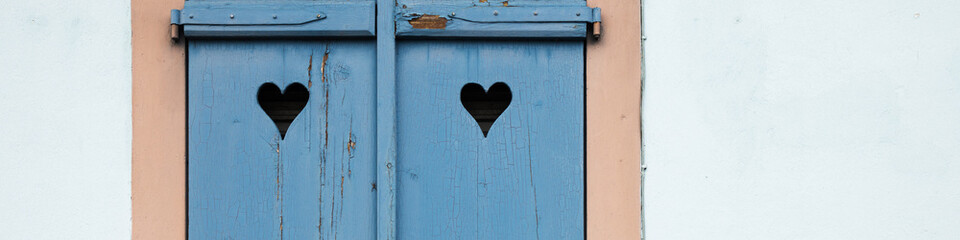 Banner old blue window with shutters, hearts on shutters, blue background