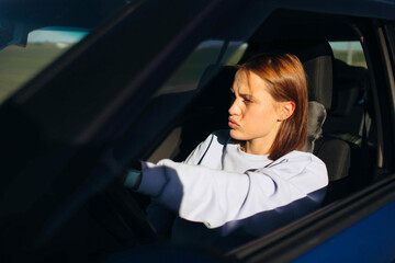 angry tired woman driving a car, woman driver conflict.