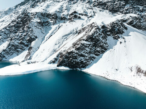 Aerial Panoramic View Of The Snowing Mountains Surrounding Laguna Del Inca In The Chilean Andes, Chile.