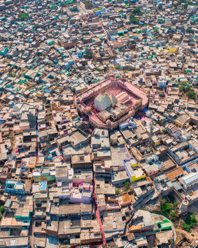 Aerial view of people celebrating the holy colour festival near the Shri And Baba Temple, Uttar Pradesh, India.