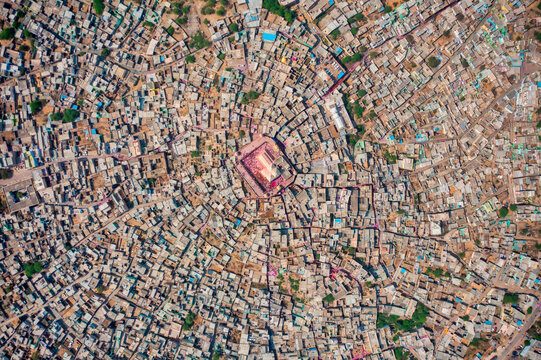 Aerial view of people celebrating the holy colour festival near the Shri And Baba Temple, Uttar Pradesh, India.