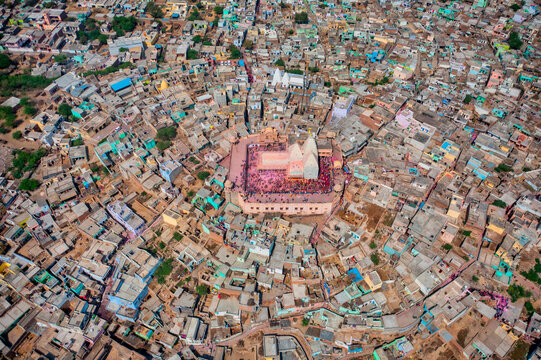 Aerial view of people celebrating the holy colour festival near the Shri And Baba Temple, Uttar Pradesh, India.