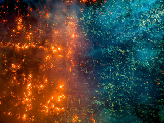 Aerial view of Firefighters and mass people were working to douse the massive fire in the capital city Dhaka at night, Bangladesh.