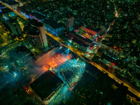 Fototapeta Aerial view of Firefighters and mass people were working to douse the massive fire in the capital city Dhaka, Bangladesh.