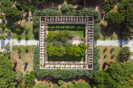 Aerial view of a square architecture in a garden with lush foliage and trees, Turia Park, Valencia, Spain.